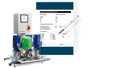 Hydro-enhed pumpesystem med kontrolpanel, ved siden af en formular og en pen.