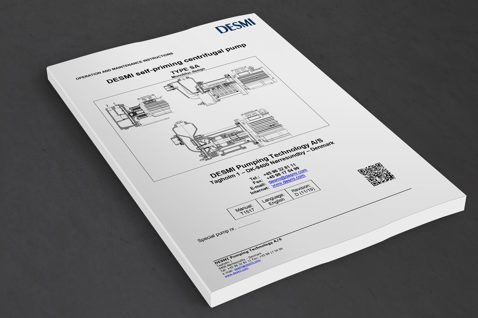 DESMI selvansugende centrifugalpumpe manual, Type SA, på en grå overflade.