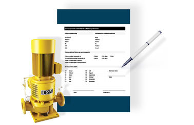 DESMI pumpe ved siden af en formular og pen til udfyldelse af serviceaftale.