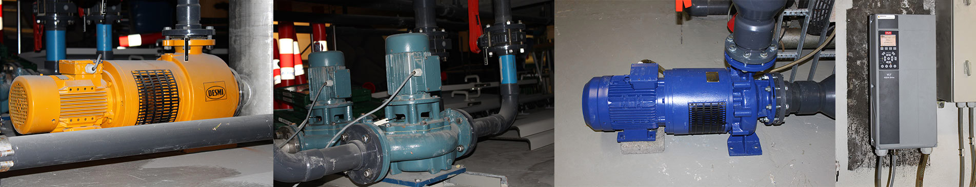 Industrielle pumper og motorsystemer, herunder en DESMI-pumpe, installeret i en facilitet.