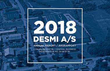 Forsiden af 2018 DESMI A/S Årsrapport med luftfoto af faciliteterne.