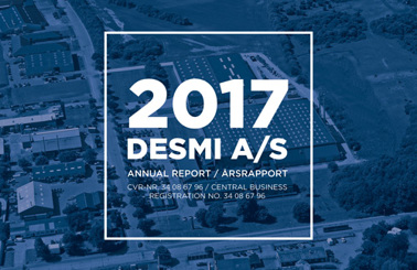 Forside af 2017 DESMI A/S årsrapport med luftfoto af landskab i baggrunden.