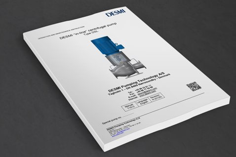 DESMI in-line centrifugalpumpe Type DSL manual på en mørk overflade.